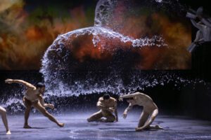 Dancer performing on stage in Castor et Pollux with strong directional lighting