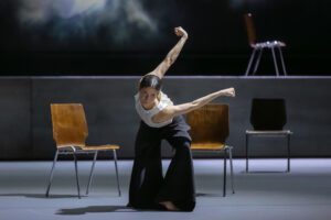 Dancer performing on stage in Castor et Pollux with strong directional lighting