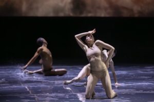 Dancer performing on stage in Castor et Pollux with strong directional lighting