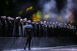 Opera scene from Castor et Pollux at the Grand Théâtre de Genève with dramatic lighting and minimal stage design