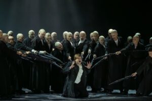 Opera scene from Castor et Pollux at the Grand Théâtre de Genève with dramatic lighting and minimal stage design