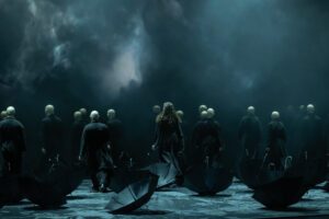 Opera scene from Castor et Pollux at the Grand Théâtre de Genève with dramatic lighting and minimal stage design