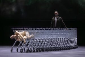 Opera scene from Castor et Pollux at the Grand Théâtre de Genève with dramatic lighting and minimal stage design