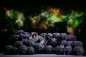 Opera scene from Castor et Pollux at the Grand Théâtre de Genève with dramatic lighting and minimal stage design