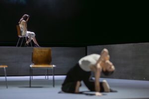 Opera scene from Castor et Pollux at the Grand Théâtre de Genève with dramatic lighting and minimal stage design