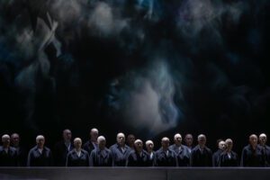Opera scene from Castor et Pollux at the Grand Théâtre de Genève with dramatic lighting and minimal stage design