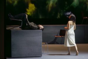 Opera scene from Castor et Pollux at the Grand Théâtre de Genève with dramatic lighting and minimal stage design