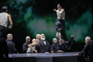 Dancer performing on stage in Castor et Pollux with strong directional lighting