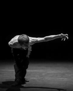 Dancer performing Marco Goecke’s Dark Matter on stage at Theater Basel
