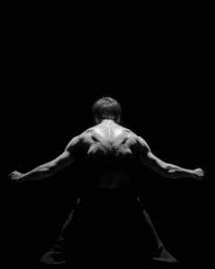 Dancer performing Marco Goecke’s Dark Matter on stage at Theater Basel