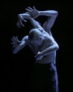 Dancers performing Marco Goecke’s Dark Matter on stage at Theater Basel