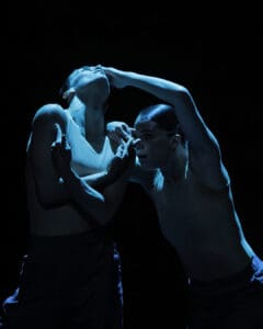 Dancers performing Marco Goecke’s Dark Matter on stage at Theater Basel