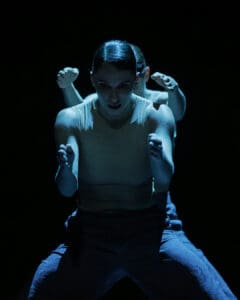 Dancers performing Marco Goecke’s Dark Matter on stage at Theater Basel