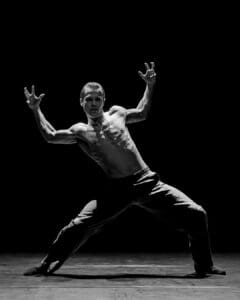 Dancer performing Marco Goecke’s Dark Matter on stage at Theater Basel