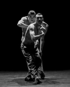 Dancers performing Marco Goecke’s Dark Matter on stage at Theater Basel