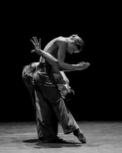 Dancers performing Marco Goecke’s Dark Matter on stage at Theater Basel