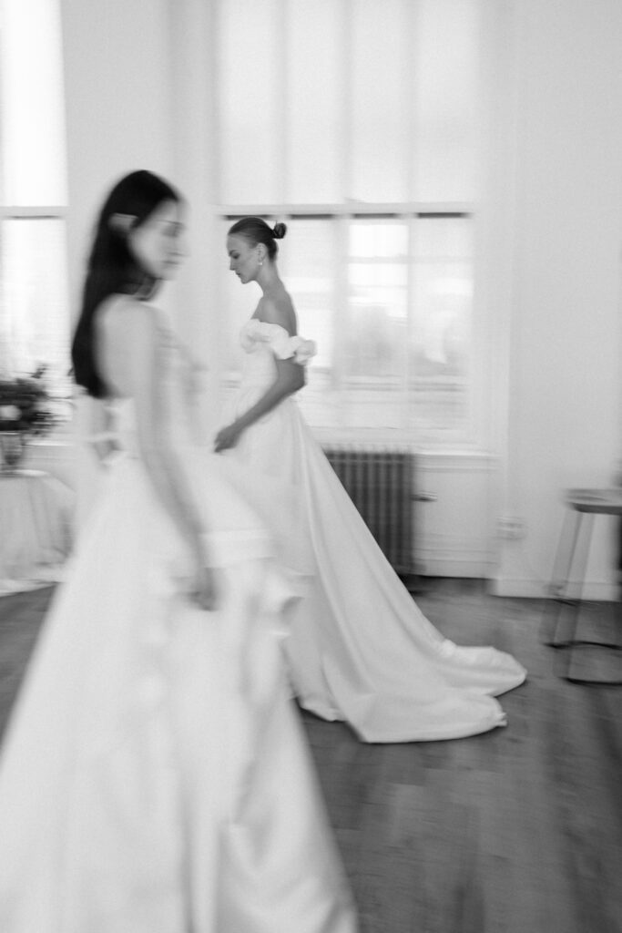 Alon Livné Bridal showcase at New York Bridal Fashion Week featuring couture wedding dresses, veils and modern bridal silhouettes.