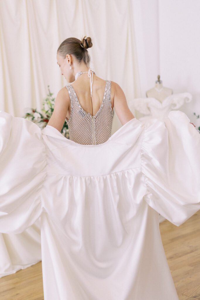 Alon Livné Bridal showcase at New York Bridal Fashion Week featuring couture wedding dresses, veils and modern bridal silhouettes.